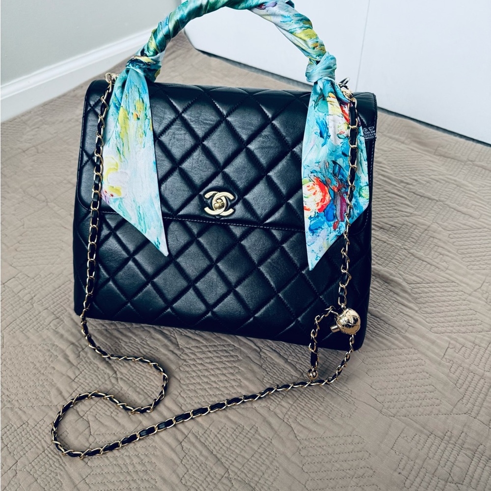 Chanel Kelly Lambskin black bag with gold hardware Top Handle $6980